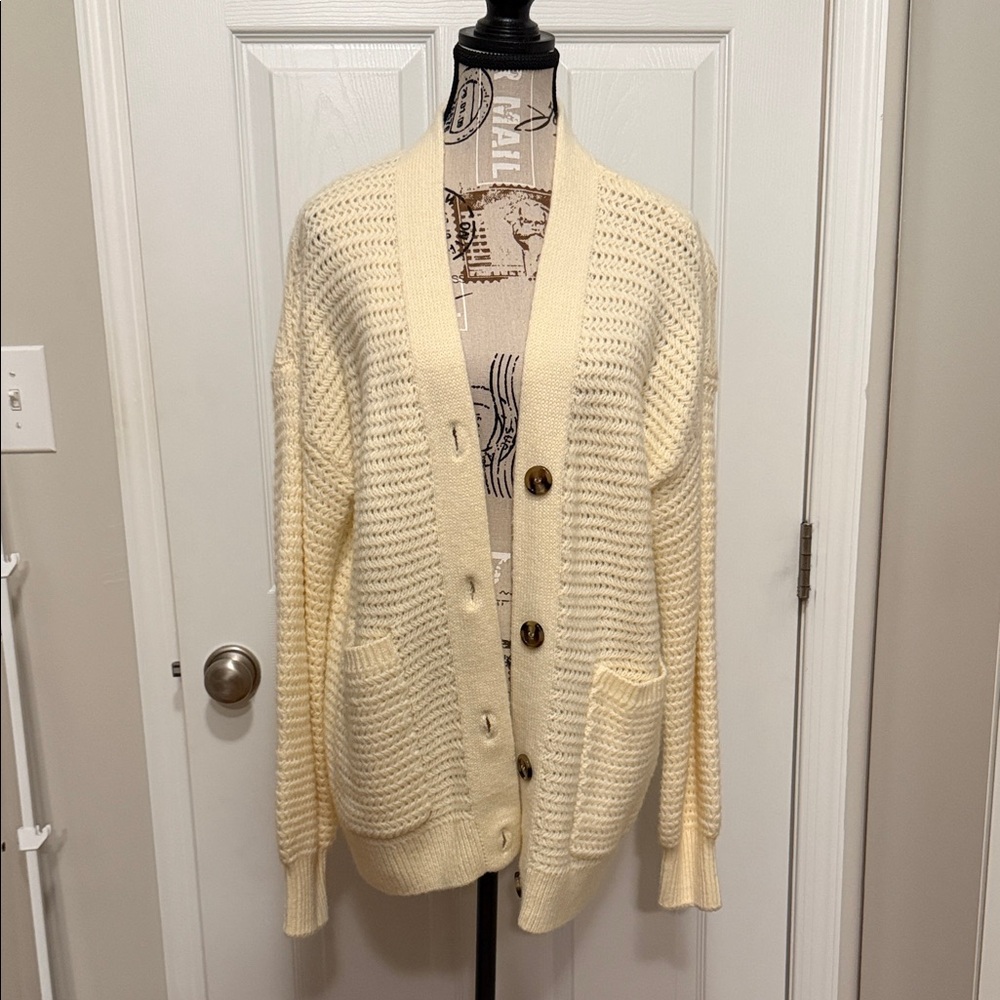 Cardigan in size large.  Cream colored.  Unworn.